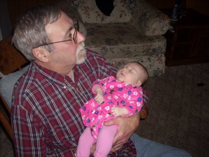 Larry holding the grandbaby. He looks like a pro at this.